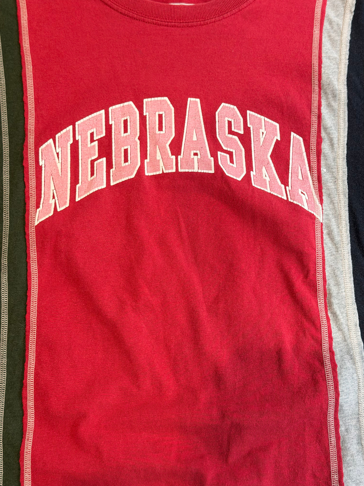 Needles Rebuild Nebraska 7 Cut T-Shirt